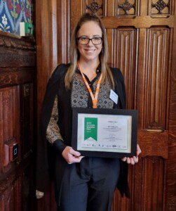 Sheree with her certificate - image from AIM Awards