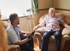 Care nurse visiting a patient at home.