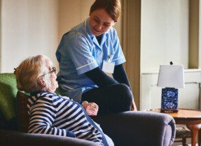 Health care nurse visiting a patient at home.